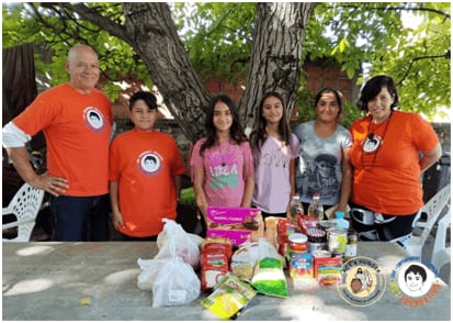 Kids donating food to poor